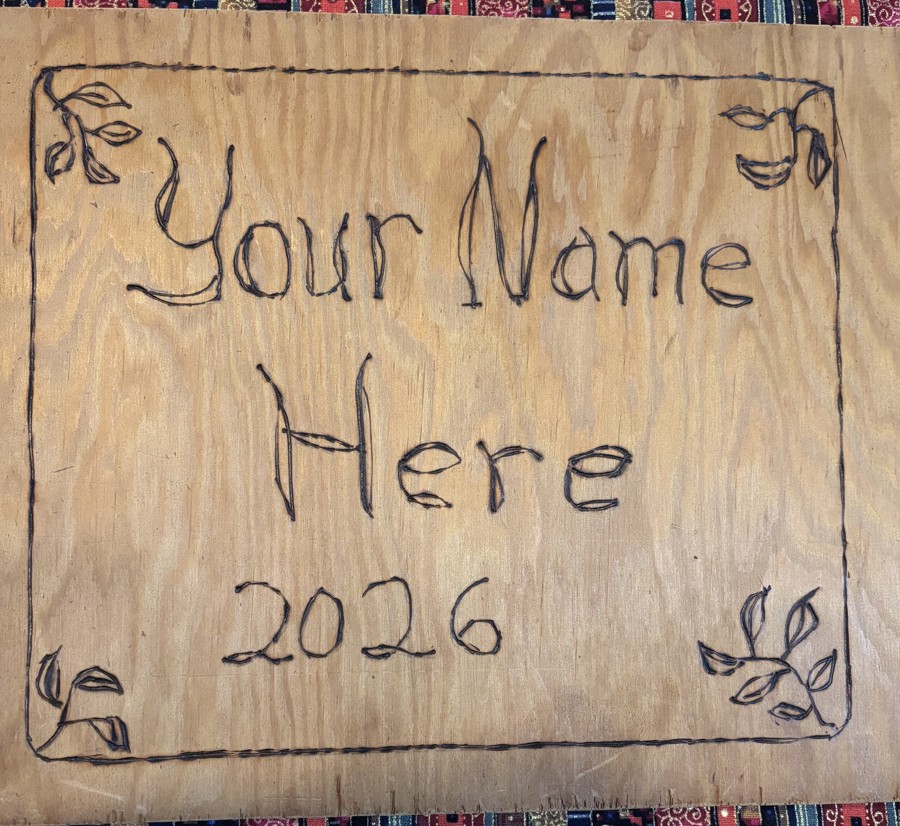 "your name here 2026" burned into pine wood